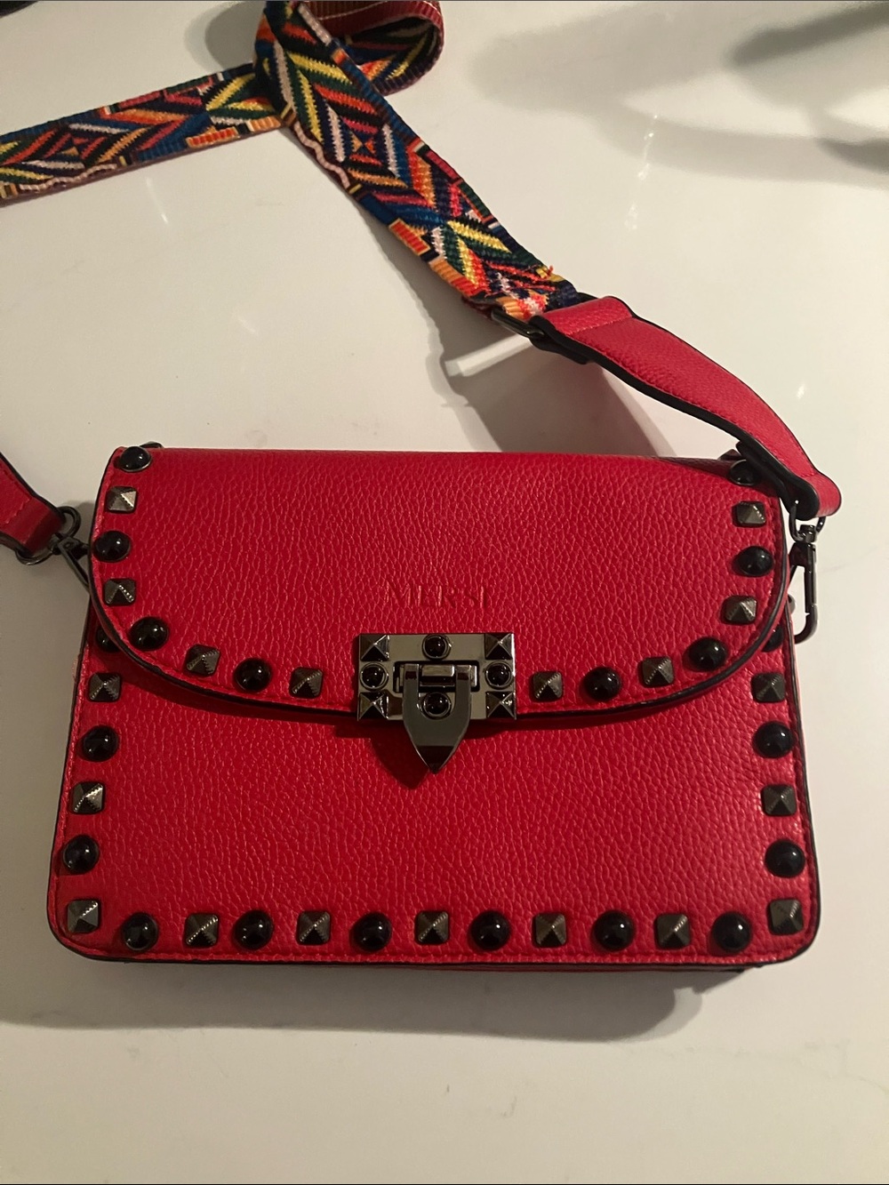 Red Studded Leather Crossbody Bag with Colorful Woven Strap
